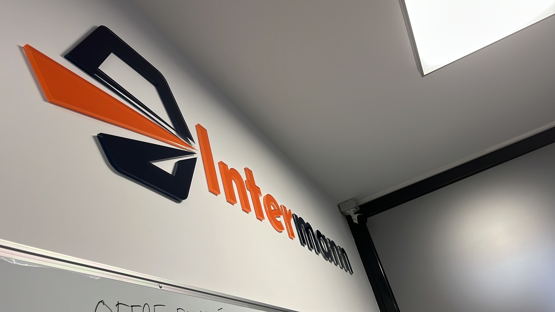 Intermann 3D logo on office wall